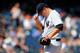 NEW YORK, NY - AUGUST 15: Phil Hughes #65 of the New York Yankees stands on the mound in the fourth inning against the Los Angeles Angels of Anaheim at Yankee Stadium on August 15, 2013 in the Bronx borough of New York City. (Photo by Jim McIsaac/Getty