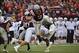 Nov 16, 2013; Blacksburg, VA, USA; Virginia Tech Hokies quarterback Logan Thomas (3) is tackled by Maryland Terrapins linebacker Cole Farrand in the fourth quarter. The Terrapins defeated the Hokies 27-24 in overtime at Lane Stadium. Mandatory Credit: Bob