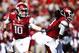 FAYETTEVILLE, AR - OCTOBER 12: Brandon Allen #10 hands off the ball to Alex Collins #3 of the Arkansas Razorbacks during a game against the South Carolina Gamecocks at Razorback Stadium on October 12, 2013 in Fayetteville, Arkansas. (Photo by Wesley Hit