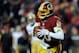 LANDOVER, MD - NOVEMBER 25: Robert Griffin III #10 of the Washington Redskins scrambles with the ball in the fourth quarter during an NFL game against the San Francisco 49ers at FedExField on November 25, 2013 in Landover, Maryland. (Photo by Patrick Mc
