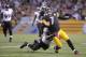 PITTSBURGH, PA - OCTOBER 20: Ben Roethlisberger #7 of the Pittsburgh Steelers is tackled from behind by Jameel McClain #53 of the Baltimore Ravens during the fourth quarter at Heinz Field on October 20, 2013 in Pittsburgh, Pennsylvania. (Photo by Vincent