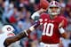 TUSCALOOSA, AL - NOVEMBER 24: AJ McCarron #10 of the Alabama Crimson Tide passes the ball against pressure by Dee Ford #95 of the Auburn Tigers at Bryant-Denny Stadium on November 24, 2012 in Tuscaloosa, Alabama. (Photo by Kevin C. Cox/Getty Images)