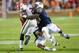 AUBURN, AL - NOVEMBER 10: Linebacker Cassanova McKinzy #30 and Defensive back Demetruce McNeal #12 of the Auburn Tigers attempt to tackle cornerback Malcolm Mitchell #26 of the Georgia Bulldogs on November 10, 2012 at Jordan-Hare Stadium in Auburn, Alaba