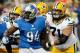 DETROIT, MI - NOVEMBER 28: Josh Sitton #71 of the Green Bay Packers tries to block Ezekiel Ansah #94 of the Detroit Lions during the first quarter at Ford Field on November 28, 2013 in Detroit, Michigan. (Photo by Gregory Shamus/Getty Images)