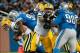 Nov 28, 2013; Detroit, MI, USA; Detroit Lions defensive end Ezekiel Ansah (94) sacks Green Bay Packers quarterback Matt Flynn (10) during the first quarter during a NFL football game on Thanksgiving at Ford Field. Mandatory Credit: Tim Fuller-USA TODAY Sp