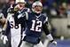 Nov 24, 2013; Foxborough, MA, USA; New England Patriots quarterback Tom Brady (12) reacts after a completed pass against the Denver Broncos during overtime at Gillette Stadium Stadium. Mandatory Credit: Greg M. Cooper-USA TODAY Sports