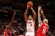 MIAMI, FL - NOVEMBER 19: Michael Beasley #8 of the Miami Heat shoots against Pero Antic #6 of the Atlanta Hawks on November 19, 2013 at American Airlines Arena in Miami, Florida. NOTE TO USER: User expressly acknowledges and agrees that, by downloading an