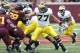 Nov 3, 2012; Minneapolis, MN, USA: Michigan Wolverines offensive linesman Taylor Lewan (77) makes a block in the second half against the Minnesota Golden Gophers at TCF Bank Stadium. Mandatory Credit: Jesse Johnson-USA TODAY Sports