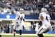 Nov 28, 2013; Arlington, TX, USA; Oakland Raiders quarterback Matt McGloin (14) throws a pass against the Dallas Cowboys in the first quarter during a NFL football game on Thanksgiving at AT&T Stadium. Mandatory Credit: Tim Heitman-USA TODAY Sports