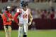 Sep 28, 2013; Tuscaloosa, AL, USA; Mississippi Rebels head coach Hugh Freeze talks with quarterback Bo Wallace (14) during a timeout against the Alabama Crimson Tide in the third quarter at Bryant-Denny Stadium. The Alabama Crimson Tide defeated the Missi