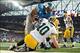 Nov 28, 2013; Detroit, MI, USA; Detroit Lions defensive tackle Ndamukong Suh (90) sacks Green Bay Packers quarterback Matt Flynn (10) in the end zone for a safety during the third quarter during a NFL football game on Thanksgiving at Ford Field. Mandatory