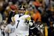 BALTIMORE, MD - NOVEMBER 28: Quarterback Ben Roethlisberger #7 of the Pittsburgh Steelers throws a pass in the first half of an NFL game against the Baltimore Ravens at M&T Bank Stadium on November 28, 2013 in Baltimore, Maryland. (Photo by Patrick Smit