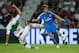 ELCHE, SPAIN - SEPTEMBER 25: Fabio Coentrao (R) of Real Madrid CF competes for the ball with David Rodriguez (L) of Elche FC during the La Liga match between Elche FC and Real Madrid CF at Estadio Manuel Martinez Valero on September 25, 2013 in Elche, Sp
