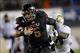 Nov 26, 2013; DeKalb, IL, USA; Northern Illinois Huskies quarterback Jordan Lynch (6) breaks the tackle of Western Michigan Broncos cornerback Ronald Zamort (7) to score his third touchdown during the third quarter at Huskie Stadium. Mandatory Credit: Mik