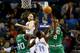 CHARLOTTE, NC - NOVEMBER 25: Teammates Brandon Bass #30 and Jeff Green #8 of the Boston Celtics go after a loose ball with teammates Josh McRoberts #11 of the and Michael Kidd-Gilchrist #14 of the Charlotte Bobcats during their game at Time Warner Cable