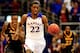 LAWRENCE, KS - NOVEMBER 22: Andrew Wiggins #22 of the Kansas Jayhawks drives upcourt on a fast break as Timajh Parker-Rivera #15 and Rafriel Guthrie #22 of the Towson Tigers chase during the game at Allen Fieldhouse on November 22, 2013 in Lawrence, Kansa