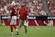 GLENDALE, AZ - SEPTEMBER 15: Arizona Cardinals head coach Bruce Arians looks on, as quarterback Carson Palmer #3 walks by against the Detroit Lions at University of Phoenix Stadium on September 15, 2013 in Glendale, Arizona. (Photo by Jeff Gross/Getty I