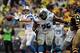 Nov 17, 2013; Pittsburgh, PA, USA; Detroit Lions quarterback Matt Stafford (9) throws a pass under protection by guard Larry Warford (75) during the first quarter at Heinz Field. Mandatory Credit: Jason Bridge-USA TODAY Sports