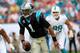 MIAMI GARDENS, FL - NOVEMBER 24: Cam Newton #1 of the Carolina Panthers looks to pass the ball in the second quarter against the Miami Dolphins at Sun Life Stadium on November 24, 2013 in Miami Gardens, Florida. (Photo by Chris Trotman/Getty Images)