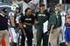EAST RUTHERFORD, NJ - SEPTEMBER 22: Full back Tommy Bohanon #40, quarterbacks Mark Sanchez #6, Brady Quinn #9 and Matt Simms #5 of the New York Jets joke with offensive coordinator Marty Mornhinweg during the fourth quarter of a game against he Buffalo B