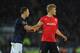 CARDIFF, WALES - NOVEMBER 24: Manchester United player Jonny Evans (l) josstles with Cardiff player Andreas Cornelius during the Barclays Premier League match between Cardiff City and Manchester United at Cardiff City Stadium on November 24, 2013 in Card