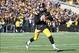 Nov 23, 2013; Iowa City, IA, USA; Iowa Hawkeyes quarterback Jake Rudock (15) rolls out to pass against the Michigan Wolverines at Kinnick Stadium. Mandatory Credit: Reese Strickland-USA TODAY Sports