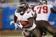 DETROIT, MI - NOVEMBER 24: Bobby Rainey #43 of the Tampa Bay Buccaneers runs for a short gain during the third quarter of the game against the Detroit Lions at Ford Field on November 24, 2013 in Detroit, Michigan. Tampa Bay defeted the Lions 24-21. (Pho