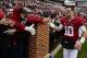 Nov 23, 2013; Tuscaloosa, AL, USA; Alabama Crimson Tide quarterback A.J. McCarron (10) celebrates by making a victory lap around the stadium after their 49-0 win over the Chattanooga Mocs at Bryant-Denny Stadium. This was McCarron's final home game of his