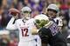 SEATTLE, WA - NOVEMBER 29: Connor Halliday #12 of Washington State passes the ball as Cory Littleton #42 of Washington puts on pressure during the first half of a game at Husky Stadium on November 29, 2013 in Seattle, Washington. (Photo by Stephen Brashea