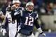 Nov 24, 2013; Foxborough, MA, USA; New England Patriots quarterback Tom Brady (12) reacts after a completed pass against the Denver Broncos during overtime at Gillette Stadium Stadium. Mandatory Credit: Greg M. Cooper-USA TODAY Sports