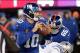 Nov 24, 2013; East Rutherford, NJ, USA; New York Giants quarterback Eli Manning (10) drops back to pass against the Dallas Cowboys during the game at MetLife Stadium. Mandatory Credit: Robert Deutsch-USA TODAY Sports
