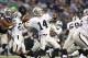 Nov 28, 2013; Arlington, TX, USA; Oakland Raiders quarterback Matt McGloin (14) throws in the pocket in the fourth quarter against the Dallas Cowboys during a NFL football game on Thanksgiving at AT&T Stadium. The Cowboys beat the Raiders 31-24. Mandatory