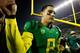 EUGENE, OR - NOVEMBER 29: Quarterback Marcus Mariota #8 of the Oregon Ducks walks off the field after a 36-35 victory against the Oregon State Beavers during the 117th playing of the Civil War on November 29, 2013 at the Autzen Stadium in Eugene, Oregon.
