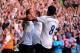 LONDON, ENGLAND - AUGUST 25: Roberto Soldado (L) of Spurs celebrates with teammates Andros Townsend (C) and Paulinho (R) after scoring the opening goal from the penalty spot during the Barclays Premier League match between Tottenham Hotspur and Swansea C