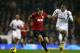 LONDON, ENGLAND - JANUARY 20: Phil Jones of Manchester United and Mousa Dembele of Tottenham Hotspur compete for the ball during the Barclays Premier League match between Tottenham Hotspur and Manchester United at White Hart Lane on January 20, 2013 in L