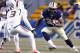 PITTSBURGH, PA - NOVEMBER 29: Isaac Bennett #34 of the Pittsburgh Panthers rushes against the Miami Hurricanes during the game on November 29, 2013 at Heinz Field in Pittsburgh, Pennsylvania. (Photo by Justin K. Aller/Getty Images)