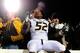 OXFORD, MS - NOVEMBER 23: Michael Sam #52 of the Missouri Tigers celebrates with fans following a victory over the Ole Miss Rebels at Vaught-Hemingway Stadium on November 23, 2013 in Oxford, Mississippi. Missouri won the game 24-10. (Photo by Stacy Rev