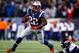 FOXBORO, MA - NOVEMBER 24: Running back Stevan Ridley #22 of the New England Patriots avoids a tackle by outside linebacker Danny Trevathan #59 of the Denver Broncos during a game at Gillette Stadium on November 24, 2013 in Foxboro, Massachusetts. (Phot