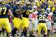 ANN ARBOR, MI - NOVEMBER 26: Kevin Koger #86 of the Michigan Wolverines celebrates a fourth quarter touchdown with Drew Dileo #26 and Brandon Moore #89 while playing the Ohio State Buckeyes at Michigan Stadium on November 26, 2011 in Ann Arbor, Michigan.