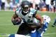 Sep 29, 2013; Jacksonville, FL, USA; Jacksonville Jaguars wide receiver Cecil Shorts III (84) is tackled by Indianapolis Colts cornerback Vontae Davis (23) during the second half of the game against the Jacksonville Jaguars at EverBank Field. Mandatory C