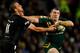 MANCHESTER, ENGLAND - NOVEMBER 30: Paul Gallen (R) of Australia is tackled by Simon Mannering of New Zealand during the Rugby League World Cup final between New Zealand and Australia at Old Trafford on November 30, 2013 in Manchester, England. (Photo by