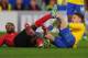CARDIFF, WALES - NOVEMBER 30: Aaron Ramsey of Arsenal scores as Kevin Theophile-Catherine of Cardiff looks goalwards during the Barclays Premier League match between Cardiff City and Arsenal at Cardiff City Stadium on November 30, 2013 in Cardiff, Wales.