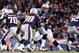 FOXBORO, MA - NOVEMBER 24: Quarterback Tom Brady #12 of the New England Patriots drops back against the Denver Broncos during a game at Gillette Stadium on November 24, 2013 in Foxboro, Massachusetts. (Photo by Jim Rogash/Getty Images)
