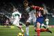 ELCHE, SPAIN - NOVEMBER 30: Damian Suarez (L) of Elche competes for the ball with Diego Costa of Atletico de Madrid during the La Liga match between Elche FC and Atletico de Madrid at Estadio Manuel Martinez Valero on November 30, 2013 in Elche, Spain.