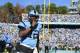 Nov 30, 2013; Chapel Hill, NC, USA; North Carolina Tar Heels quarterback Marquise Williams (12) reacts after scoring a touchdown in the second quarter at Kenan Memorial Stadium. Mandatory Credit: Bob Donnan-USA TODAY Sports
