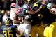 ANN ARBOR, MI - NOVEMBER 30: Running back Carlos Hyde #34 of the Ohio State Buckeyes carries the ball in the second quarter as defensive tackle Willie Henry #69 and linebacker Joe Bolden #35 of the Michigan Wolverines defend during a game at Michigan Sta