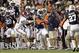 Nov 30, 2013; Auburn, AL, USA; Auburn Tigers cornerback Chris Davis (11) gets by Alabama Crimson Tide punter Cody Mandell (29) and returns a missed field goal for a 100 yard touchdown against the Alabama Crimson Tide during the fourth quarter at Jordan Ha