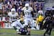 Nov 30, 2013; Fort Worth, TX, USA; Baylor Bears running back Lache Seastrunk (25) eludes TCU Horned Frogs defensive end Mike Tuaua (93) during the first quarter at Amon G. Carter Stadium. Mandatory Credit: Jerome Miron-USA TODAY Sports