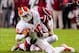 Nov 30, 2013; Columbia, SC, USA; Clemson Tigers quarterback Tajh Boyd (10) is sacked by South Carolina Gamecocks linebacker Kaiwan Lewis (8) in the second quarter at Williams-Brice Stadium. Mandatory Credit: Jeff Blake-USA TODAY Sports