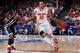 DAYTON, OH - MARCH 22: LaQuinton Ross #10 of the Ohio State Buckeyes handles the ball against Tavon Sledge #3 of the Iona Gaels in the second half during the second round of the 2013 NCAA Men's Basketball Tournament at UD Arena on March 22, 2013 in Dayton